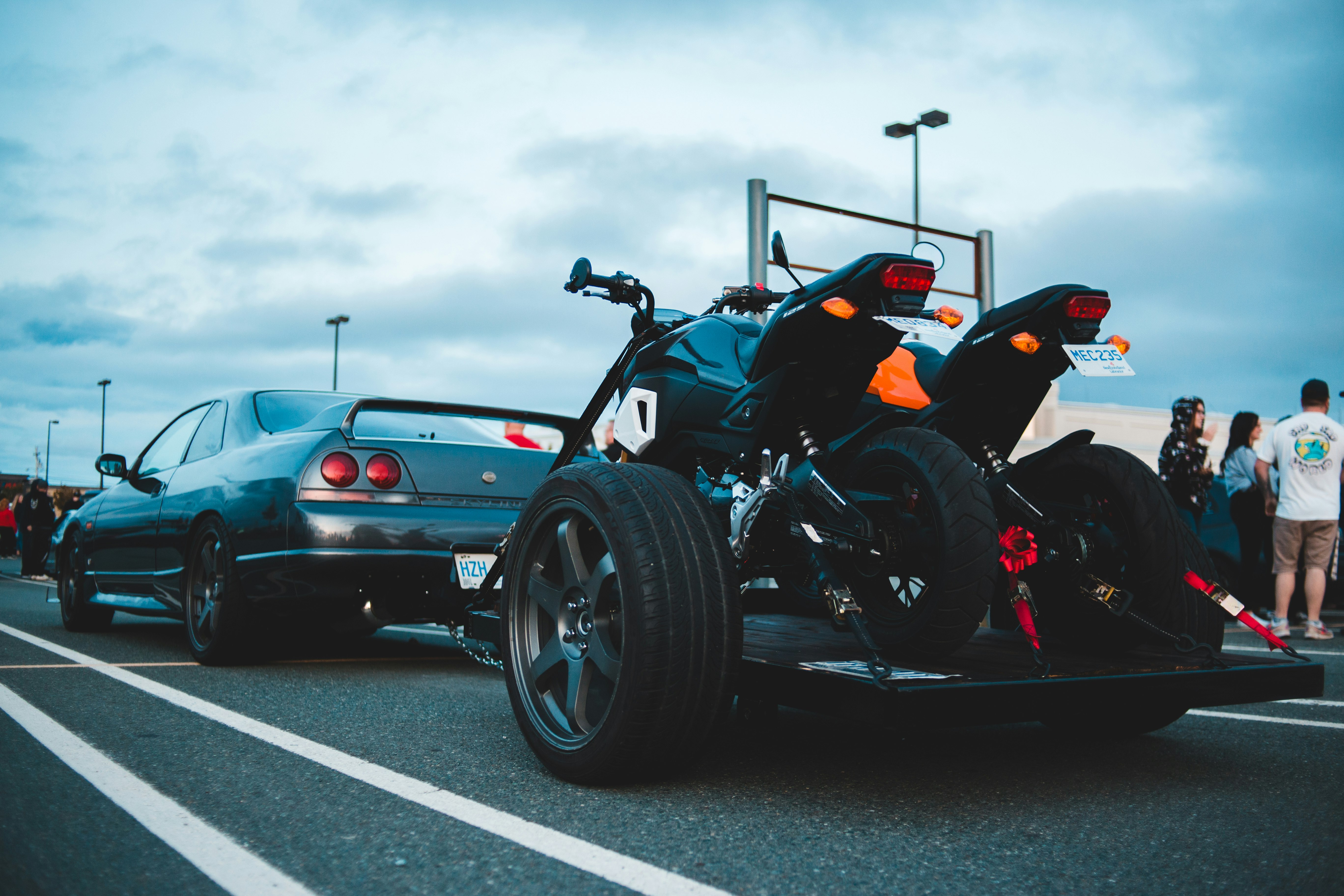 black and red sports car on road